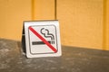 No smoking metal sign on a table Royalty Free Stock Photo