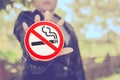 No smoking sign in hand on color background ,health