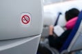 No smoking sign on plane seat Royalty Free Stock Photo