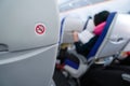 No smoking sign on plane seat Royalty Free Stock Photo