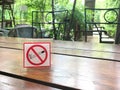 No smoking sign on restaurant table in the garden Royalty Free Stock Photo