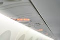 No smoking sign and seat belt sign on the airplane . Royalty Free Stock Photo