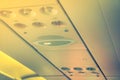 No smoking sign and seat belt sign on the airplane . ( Filtered Royalty Free Stock Photo