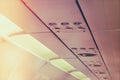 No smoking sign and seat belt sign on the airplane . ( Filtered Royalty Free Stock Photo
