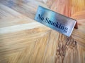 No smoking sign on wooden table Royalty Free Stock Photo