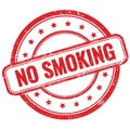 NO SMOKING text on red grungy round rubber stamp