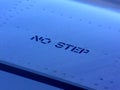 No step letter sign on an airplane wing Royalty Free Stock Photo