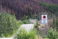 A no stopping avalanche sign with a road in the background Royalty Free Stock Photo