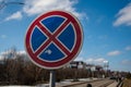 No stopping and parking road sign plate against the background of trees and sky. Selective focus copy space Royalty Free Stock Photo