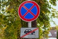 No Stopping sign with table car crossed out by a red line under it. Concept of road sign. Problem with parking Royalty Free Stock Photo