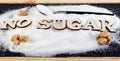 No sugar text from letters, sugar slide on a spoon, suggesting a diet and health concept