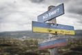 No swift text quote on wooden signpost outdoors on nato colored flag, ukrainian flag and russian flags