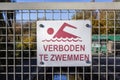A no swimming danger sign at a lake Royalty Free Stock Photo