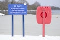 No swimming or paddling deep water danger sign and red buoy ring life save Royalty Free Stock Photo