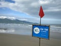No swimming sign at the beach of South China Sea in Da Nang, Vietnam