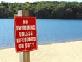 No swimming unless lifeguard on duty beach sign Royalty Free Stock Photo