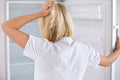 No temptations during her diet. Rearview of a young woman looking in her empty fridge. Royalty Free Stock Photo