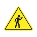 No texting while walking yellow triangular sign