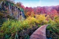 No tourist walking on wooden footbridge at the end of season in Plitvice National Park. Calm autumn scene of Croatia, Europe. Beau Royalty Free Stock Photo