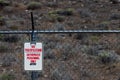 No trespassing authorized personnel sign on a chain link barbed wire fence Royalty Free Stock Photo