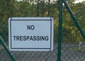 No trespassing on a green chainlink fence Royalty Free Stock Photo