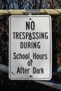 No trespassing during school hours or after dark sign