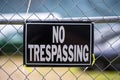 No trespassing sign on a fence. Royalty Free Stock Photo