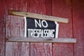 No Trespassing Sign Nailed To House Exterior