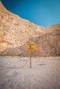 No Trespassing sign on a pole with rope near cliff, warning falling rocks, Greece Zakynthos beach Navagio near shipwreck