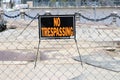 Cleveland, Ohio May 17, 2020 No Trespassing sign posted to link fence to caution no entry, danger. Royalty Free Stock Photo