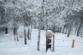 No Trespassing Sign Posted on Wooden Fence in Winter Snow Orange Notice