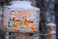 No Trespassing Sign Posted On Wooden Fence In Winter Snow Orange Notice