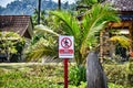 No Trespassing sign on a private beach on th the sandy beautiful exotic and stunning Cenang beach in Langkawi island, in Malaysia Royalty Free Stock Photo