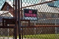 No trespassing sign on a rusted chain link fence Royalty Free Stock Photo