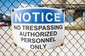 No trespassing warning sign on chain link fence Royalty Free Stock Photo