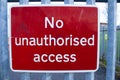 A no unauthorised access sign strap to a gate for no access