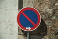 NO WAITING road sign in front of plaster and stone wall at Elvas