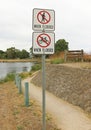 No walking or cycling on path when flooded sign