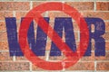 No war sign painted on old red brick wall