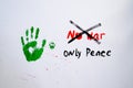 No war text with handprint and dog`s paw print on white background,soft focus. Green handprint of human and dog`s paw print with