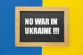 No War in Ukraine. Ukraine blue and yellow flag word inscription chalkboard