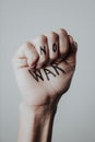 No war written in a raised fist Royalty Free Stock Photo