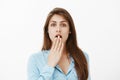 No way, unbelievable rumor. Portrait of girl pretending to be shocked while hearing gossip or eavesdropping conversation Royalty Free Stock Photo