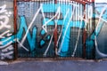 No 7 written on a graffiti gate in the city. Expression through urban art. Royalty Free Stock Photo