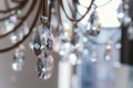 Noble and luxurious crystal chandelier light. Closeup crystal pendants of the chandelier, blur background, glamour Royalty Free Stock Photo