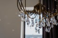 Noble and luxurious crystal chandelier light. Closeup crystal pendants of the chandelier, blur background, glamour background with Royalty Free Stock Photo