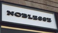 Noblesse Swiss brend sign on city street. Signboard of Breitling store, shop, mall, boutique. Swiss luxury watchmaker symbol. Kiev Royalty Free Stock Photo