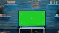 Nobody in flat with green screen tv display