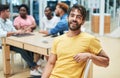 Nobody optimises the business project like a project manager. a young businessman having a meeting with his team in a Royalty Free Stock Photo