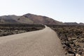Empty road at Timanfaya National Park volcanic landscape